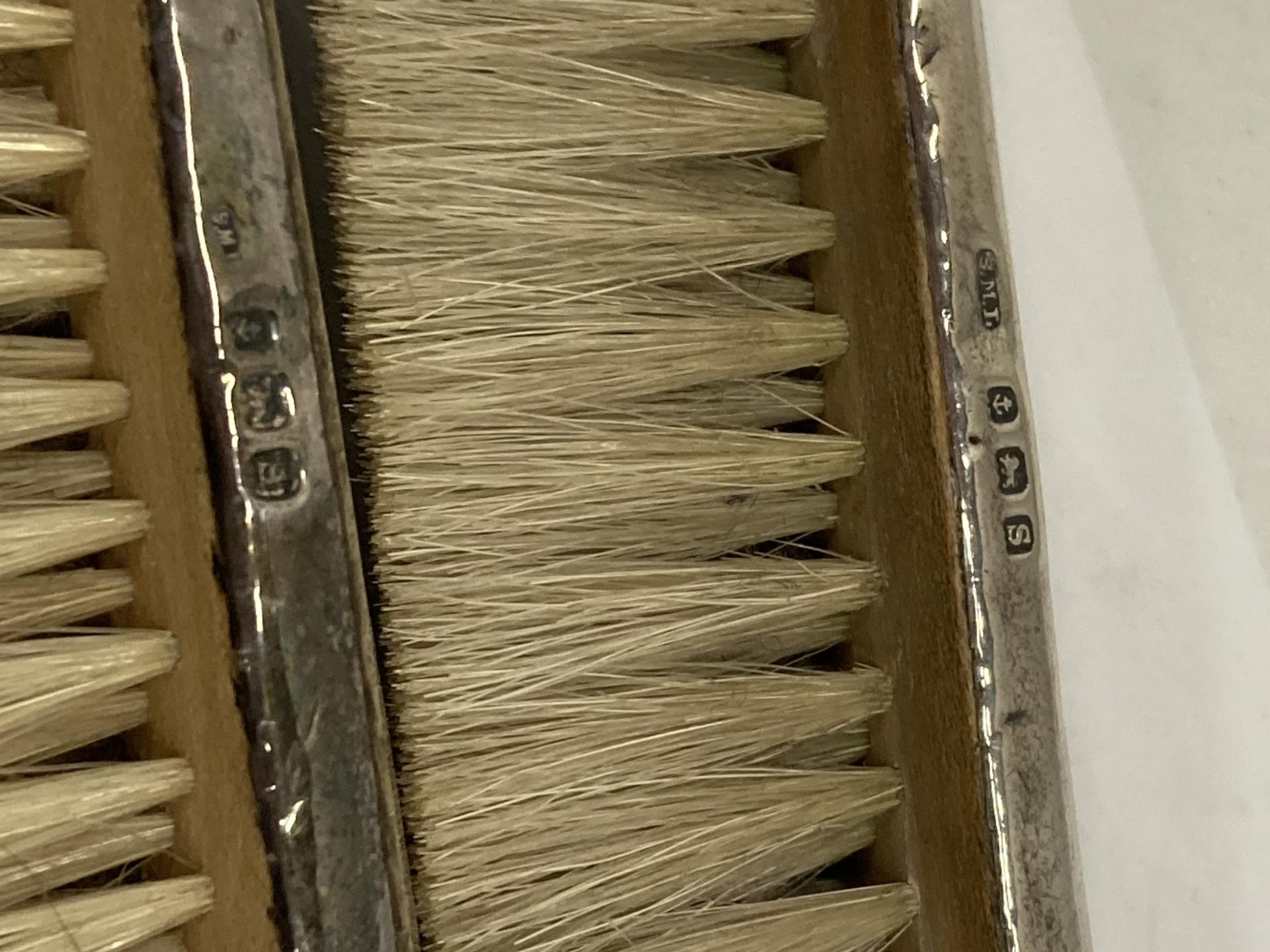 FOUR HALLMARKED SILVER ITEMS - TWO BRUSHES AND TWO NAPKIN RINGS - Image 2 of 4