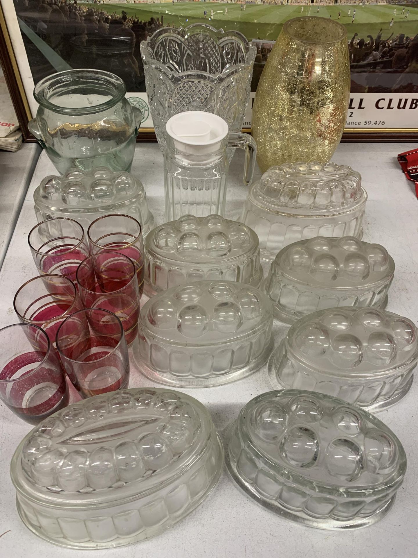 A GROUP OF VINTAGE GLASSWARE, JELLY MOULDS ETC