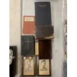 A GROUP OF VINTAGE BIBLES, TWO BADGES AND A PAIR OF FRAMED PHOTOS