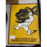 A CAST IRON MICHELIN MAN SIGN