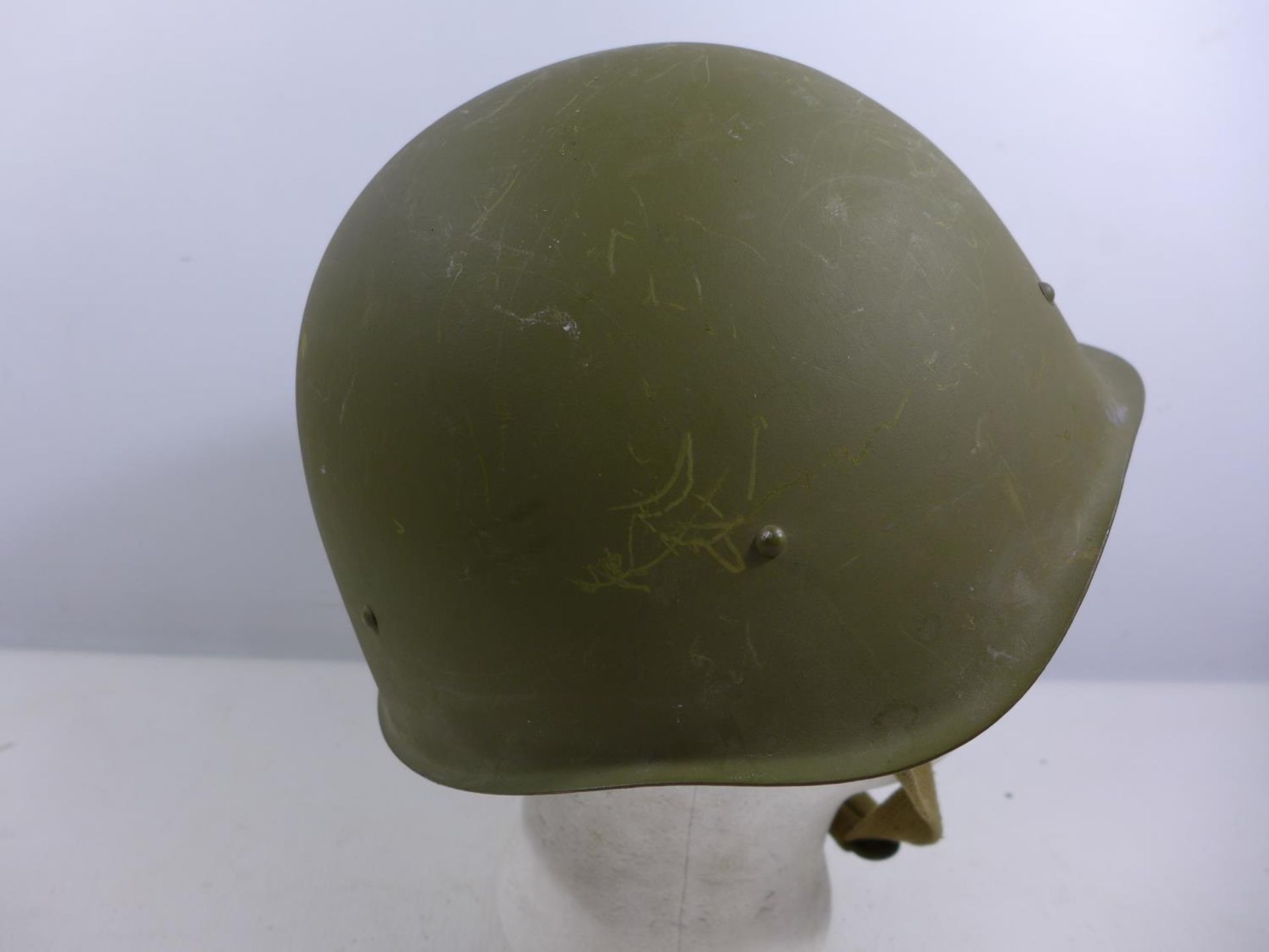 A GREEN PAINTED MILITARY HELMET WITH LEATHER LINING - Image 3 of 5