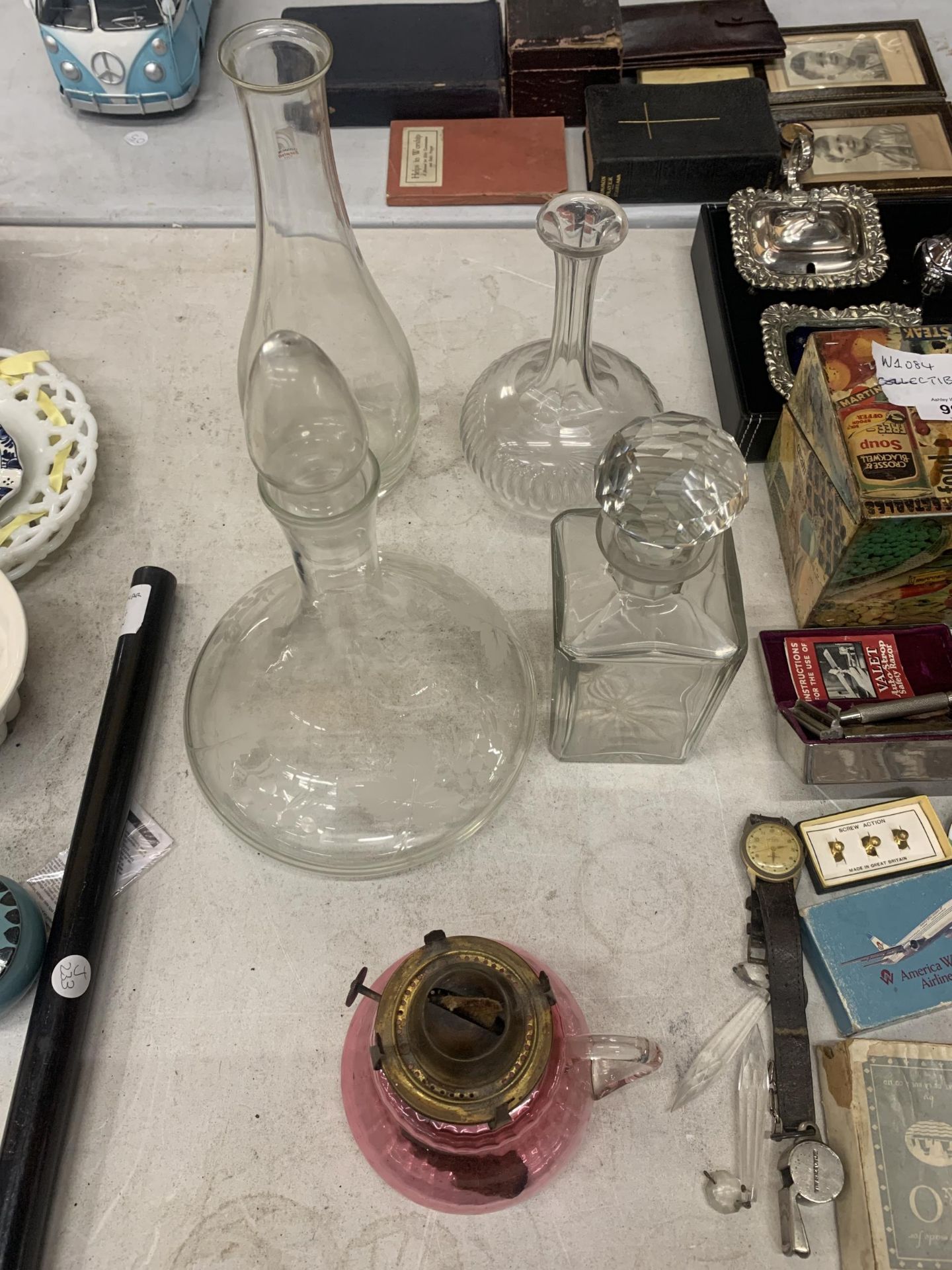 A GROUP OF VINTAGE DECANTERS AND A CRANBERRY GLASS CONVERTED OIL LAMP JUG - Image 2 of 2
