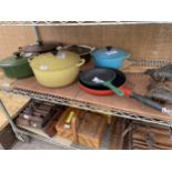 AN ASSORTMENT OF COLOURED LE CREUSET PANS TO INCLUDE CASAROLE DISHES AND FRYING PANS ETC