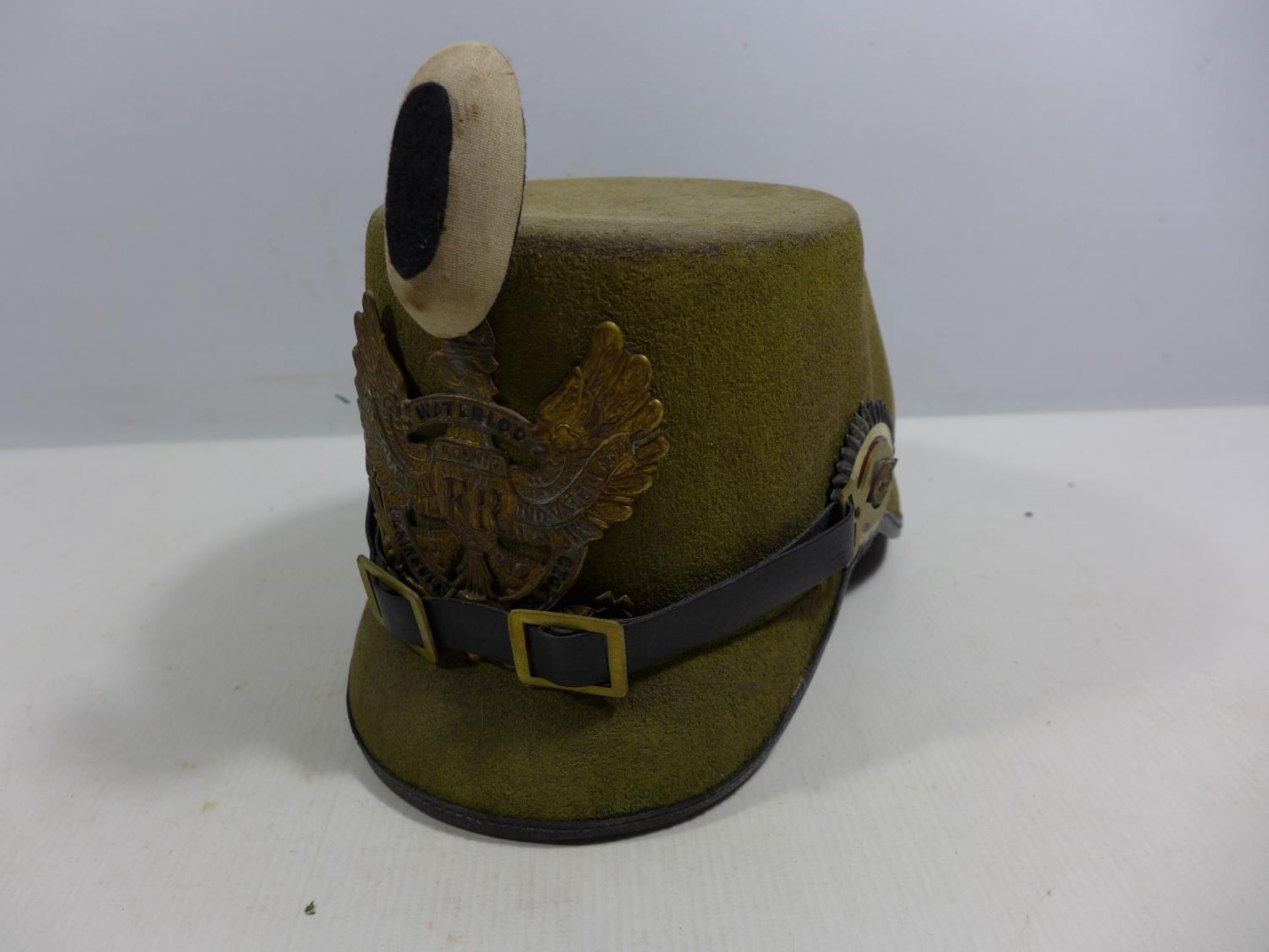 A REPLICA IMPERIAL GERMAN HELMET WITH LEATHER LINING