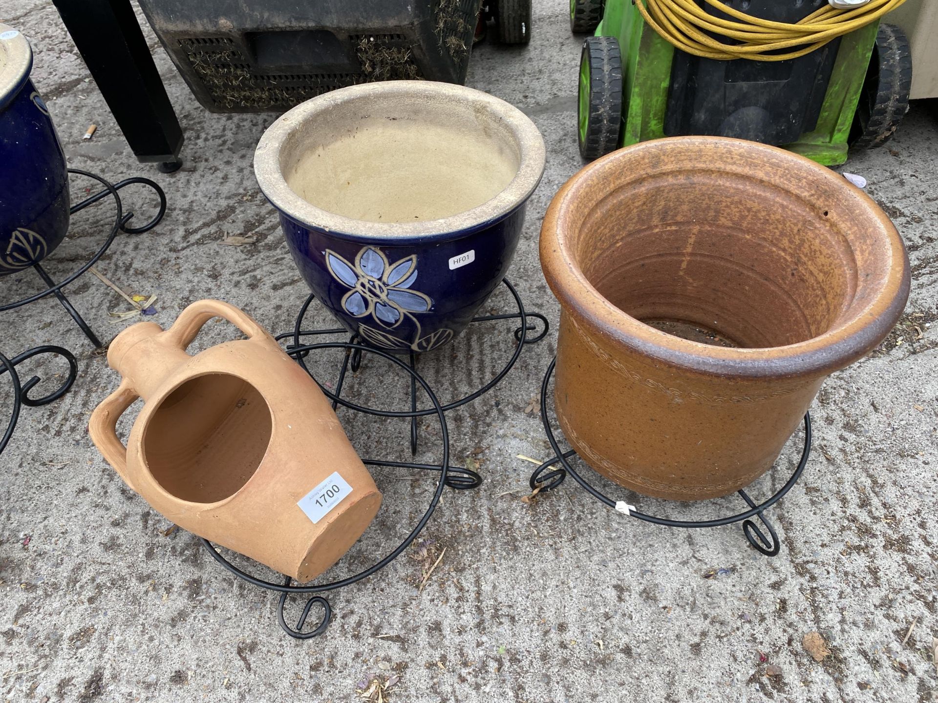 THREE VARIOUS TERACOTTA PLANTERS WITH METAL STANDS