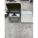 A JUNIOR-E TYPE WRITER AND A FURTHER TYPEWRITER
