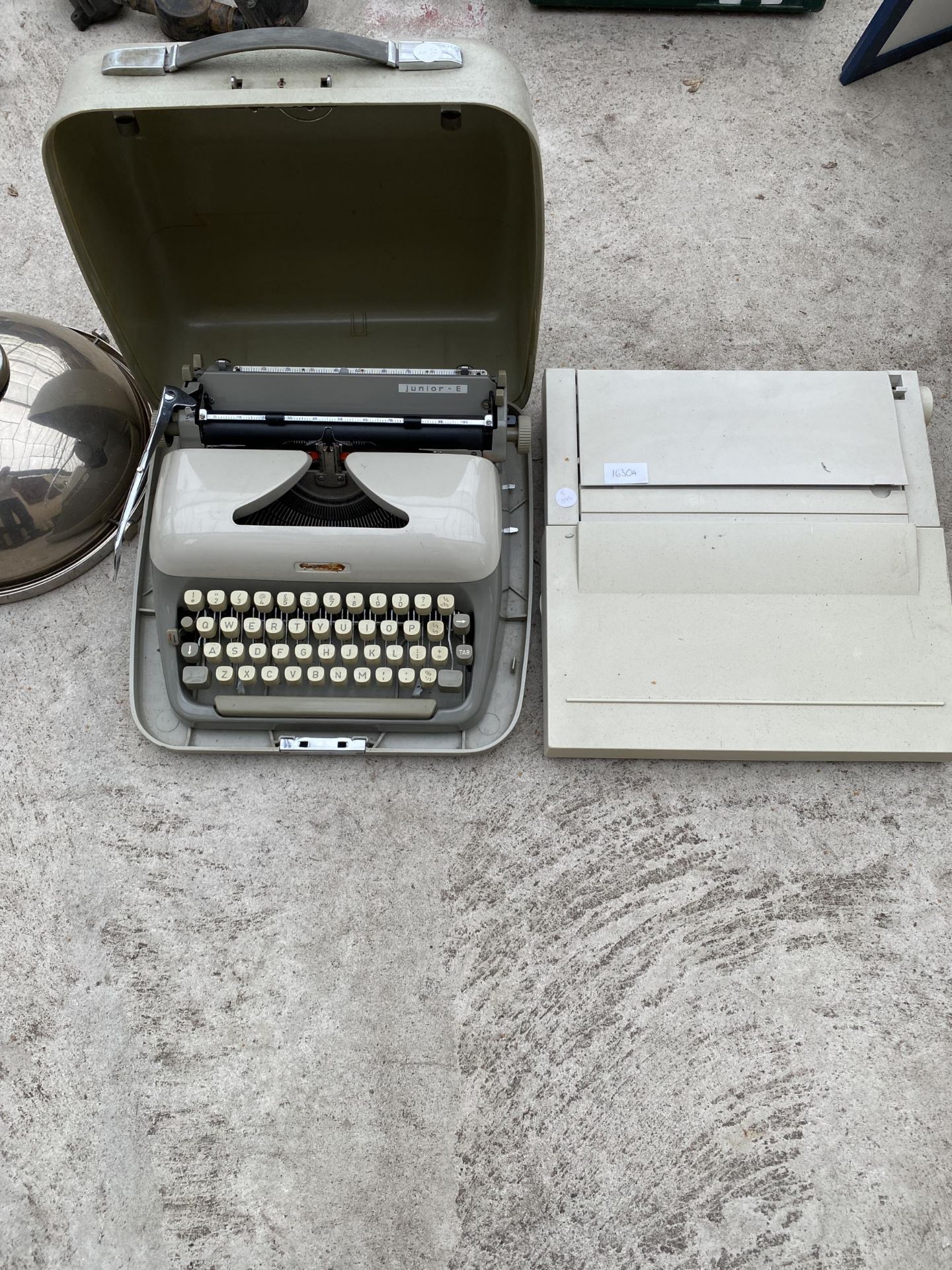 A JUNIOR-E TYPE WRITER AND A FURTHER TYPEWRITER