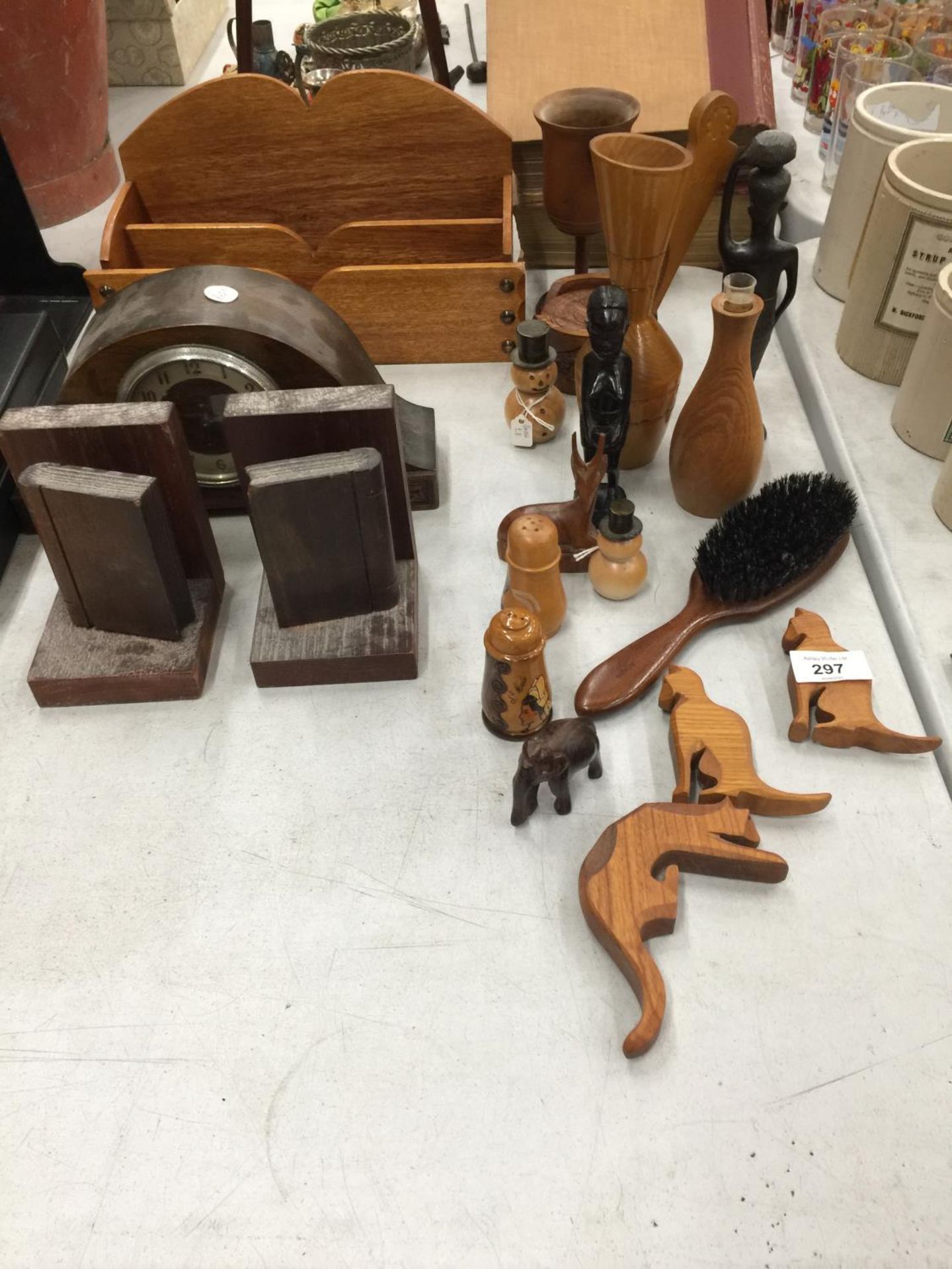 A QUANTITY OF TREEN TO INCLUDE BOOKENDS, CLOCK, FIGURES, LETTER HOLDER, ETC.,