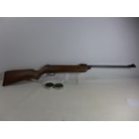 A BSA METEOR .22 CALIBRE AIR RIFLE, 47CM BARREL, SERIAL NUMBER WE16444, LENGTH 106CM, TWO TINS OF
