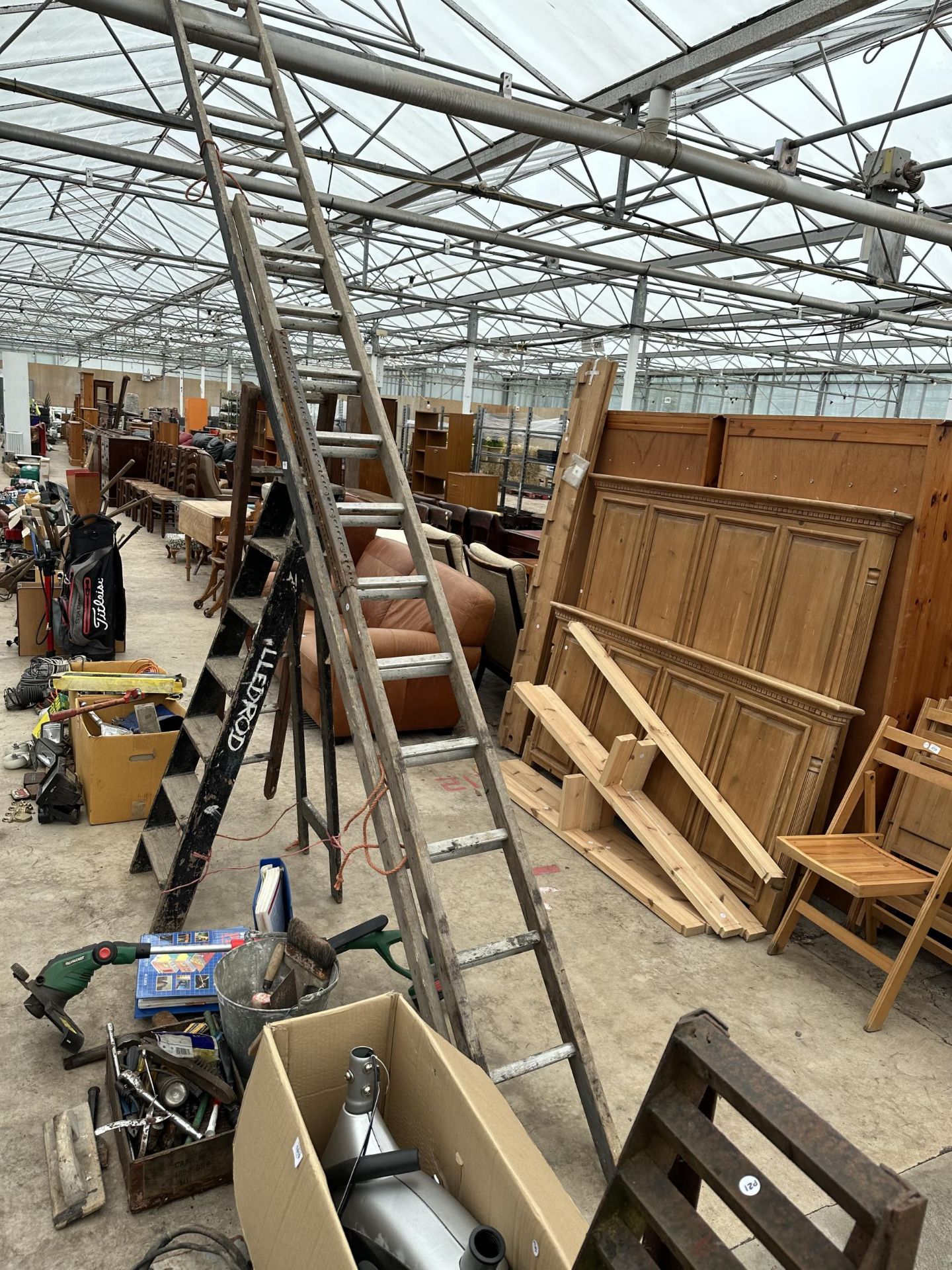 AN ASSORTMENT OF VINTAGE WOODEN LADDERS