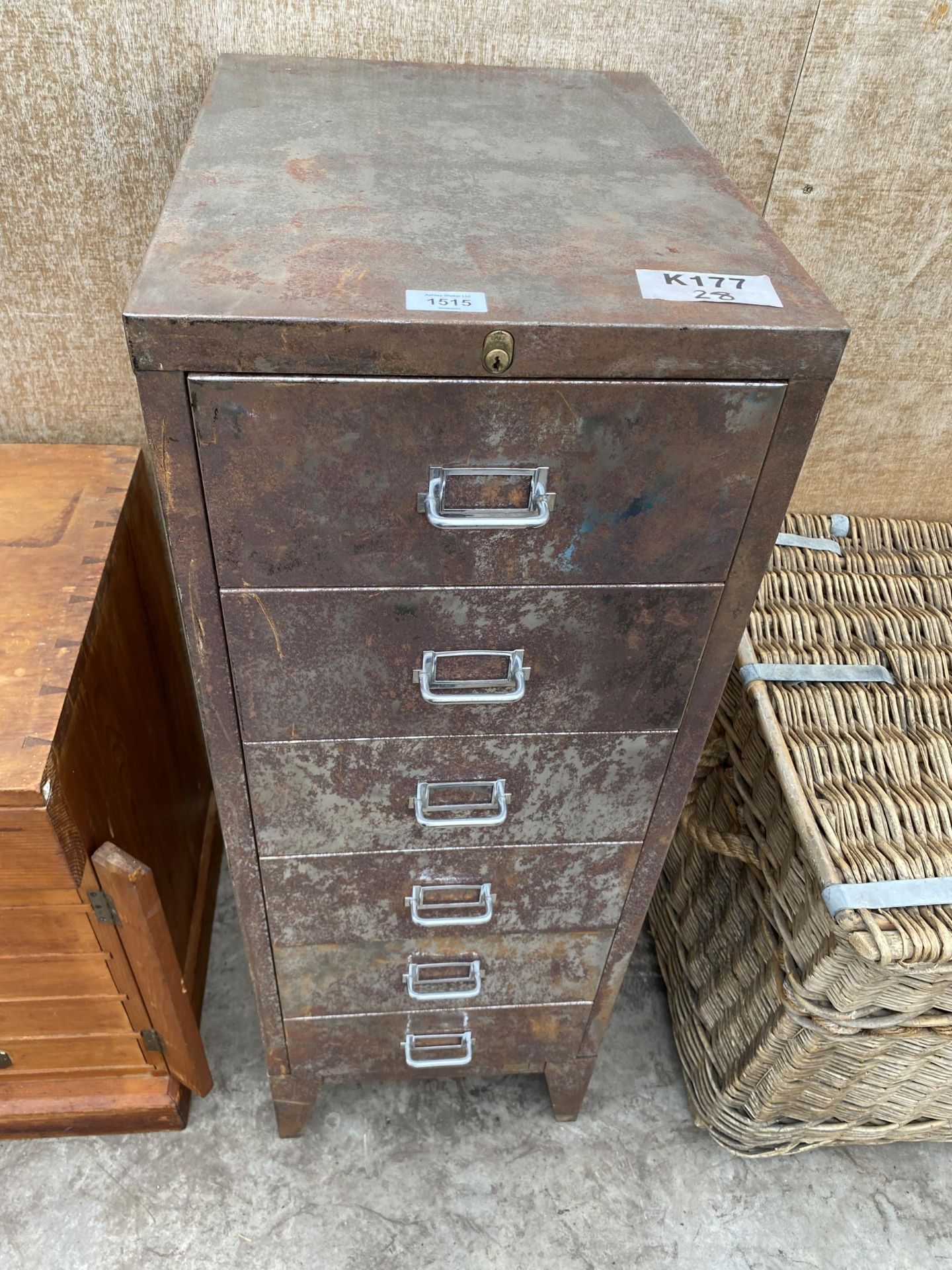 A VINTAGE SIX DRAWER METAL FILING CABINET