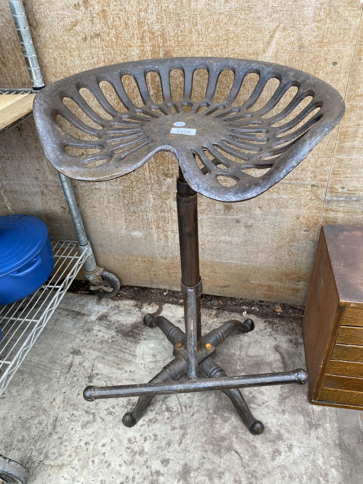 A VINTAGE STYLE TRACTOR SEAT STOOL
