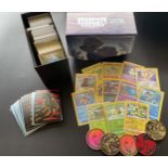 A TRAINER BOX OF ASSORTED POKEMON CARDS, GAME TOKENS, HOLOS ETC