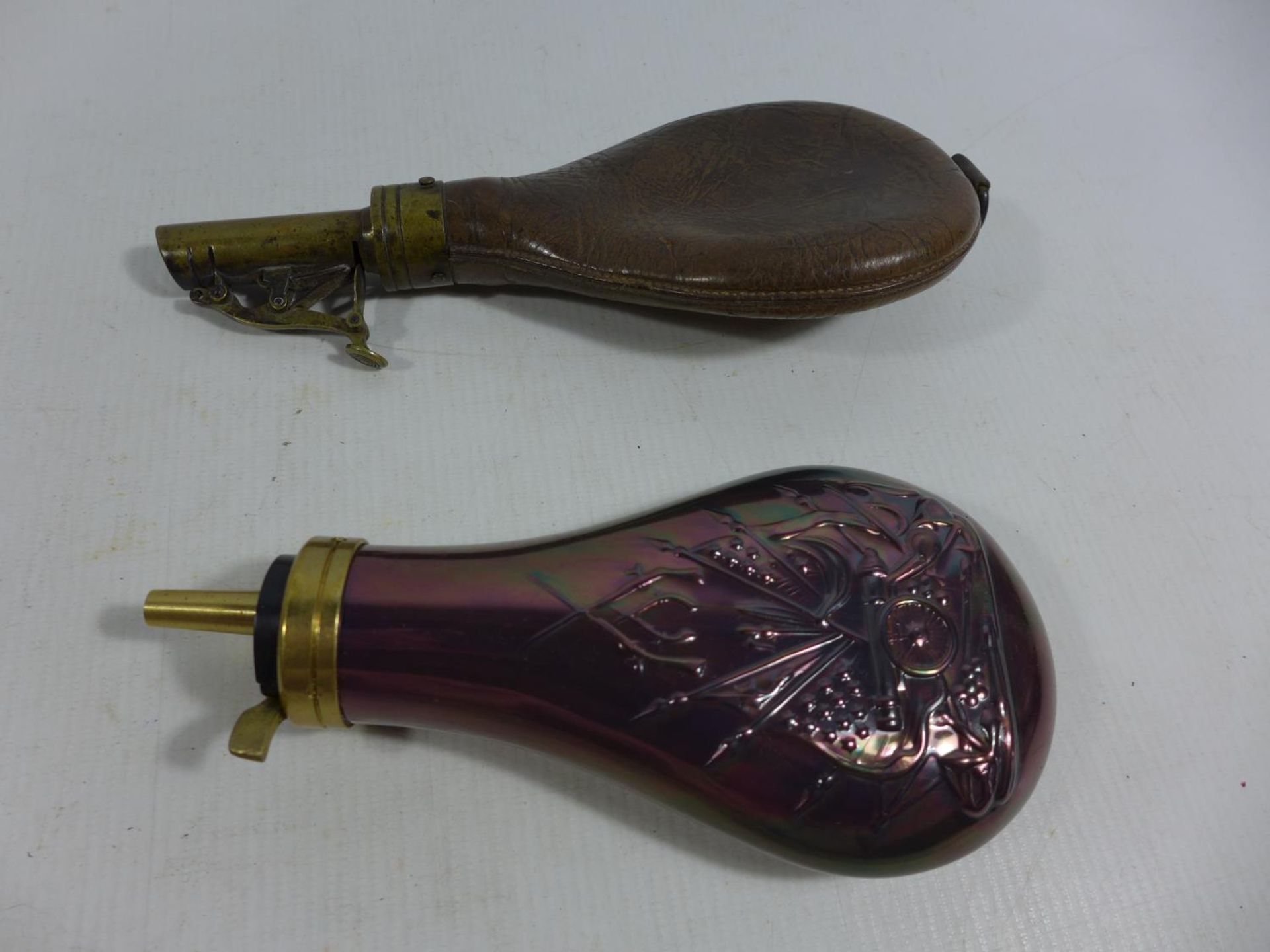 AN ANTIQUE LEATHER AND BRASS SHOT FLASK AND A COPPER AND BRASS POWDER FLASK (2) - Image 2 of 2