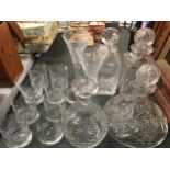 A COLLECTION OF CUT GLASS WARE, DECANTERS ETC