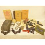 A COLLECTION OF RAF ITEMS TO INCLUDE STRIPES, BADGES, CUTLERY, BOOKLETS ETC