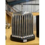 A CHROME STYLE JAGUAR RADIATOR ON BASE