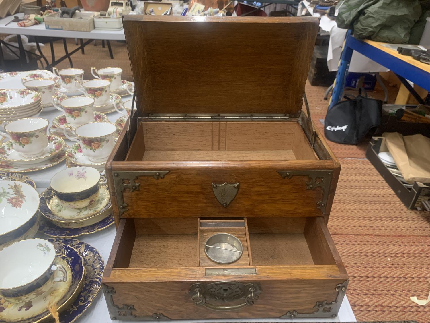 A VICTORIAN GOTHIC OAK SMOKERS CHEST WITH METAL BANDING AND SIDE HANDLES