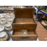 A VICTORIAN GOTHIC OAK SMOKERS CHEST WITH METAL BANDING AND SIDE HANDLES