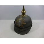 A REPLICA IMPERIAL GERMAN PICKELHAUBE METAL HELMET WITH LEATHER LINING