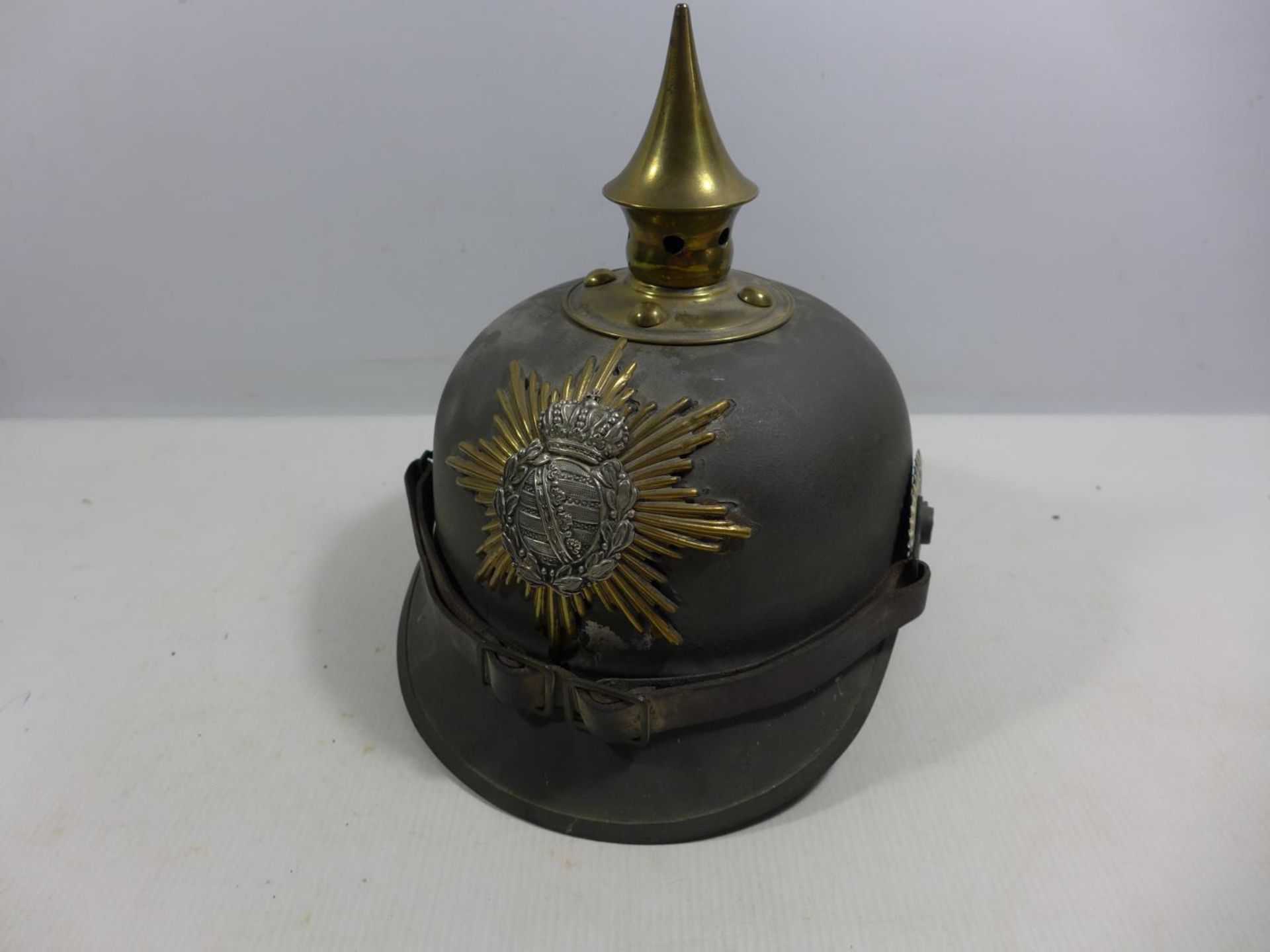 A REPLICA IMPERIAL GERMAN PICKELHAUBE METAL HELMET WITH LEATHER LINING