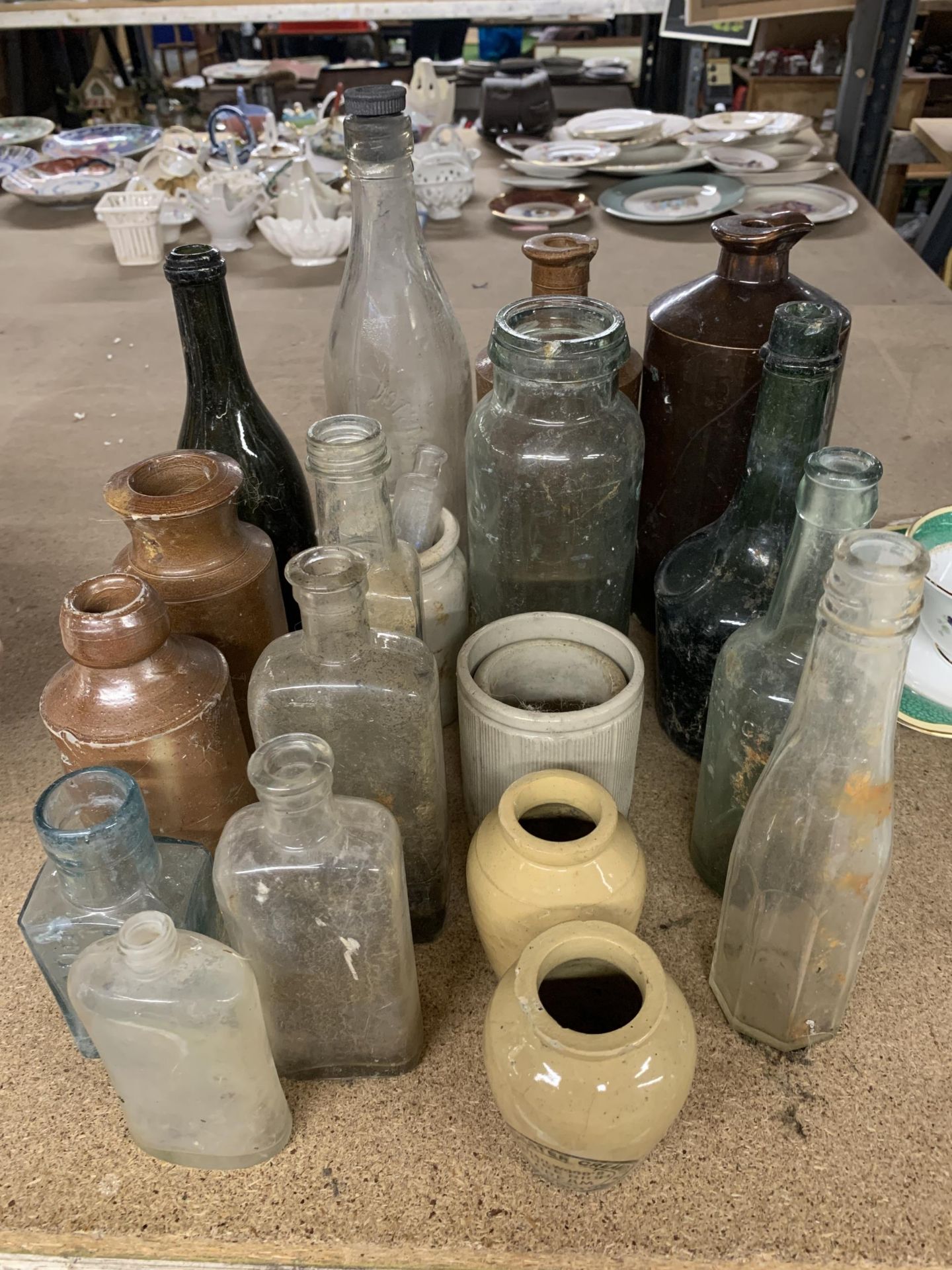 A COLLECTION OF VINTAGE GLASS AND CERAMIC BOTTLES