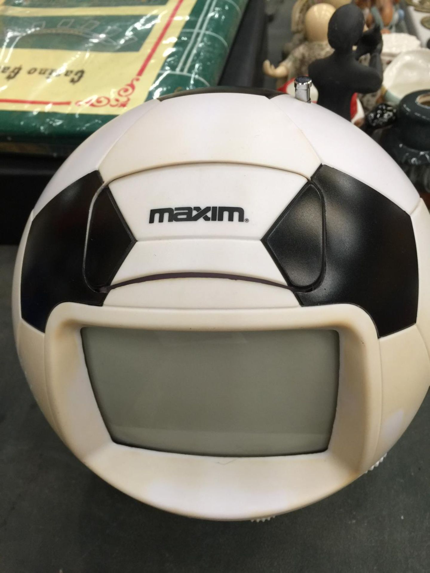 A VINTAGE MAXIM FOOTBALL TELEVISION WITH OPERATING INSTRUCTIONS