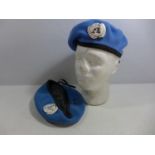 TWO UNITED NATIONS BERETS AND BADGES, SIZE 7 AND 7 1/4