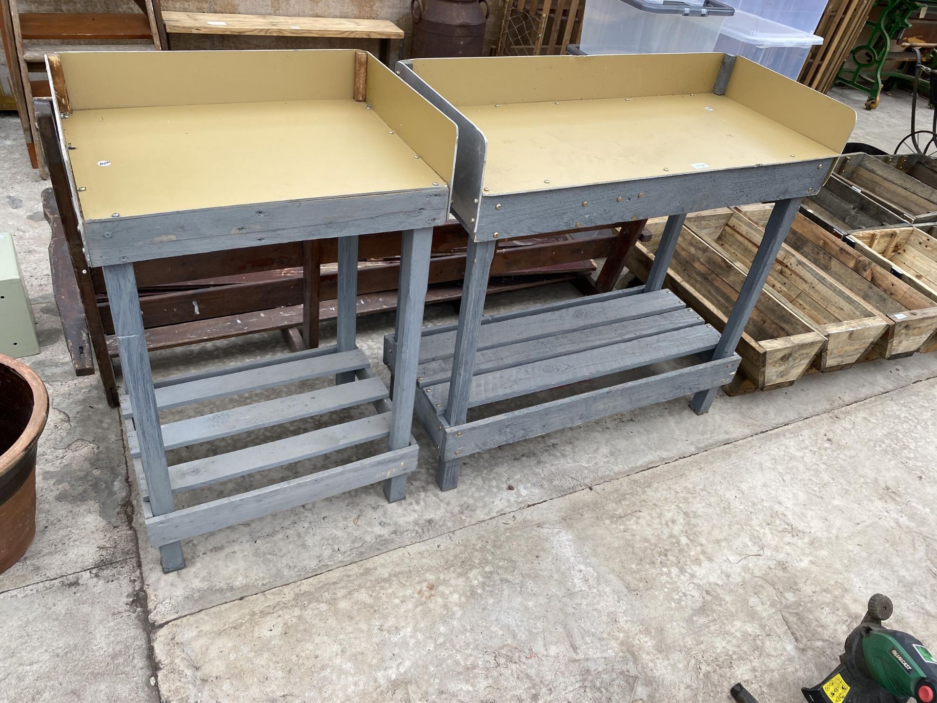 TWO WOODEN POTTING BENCHES