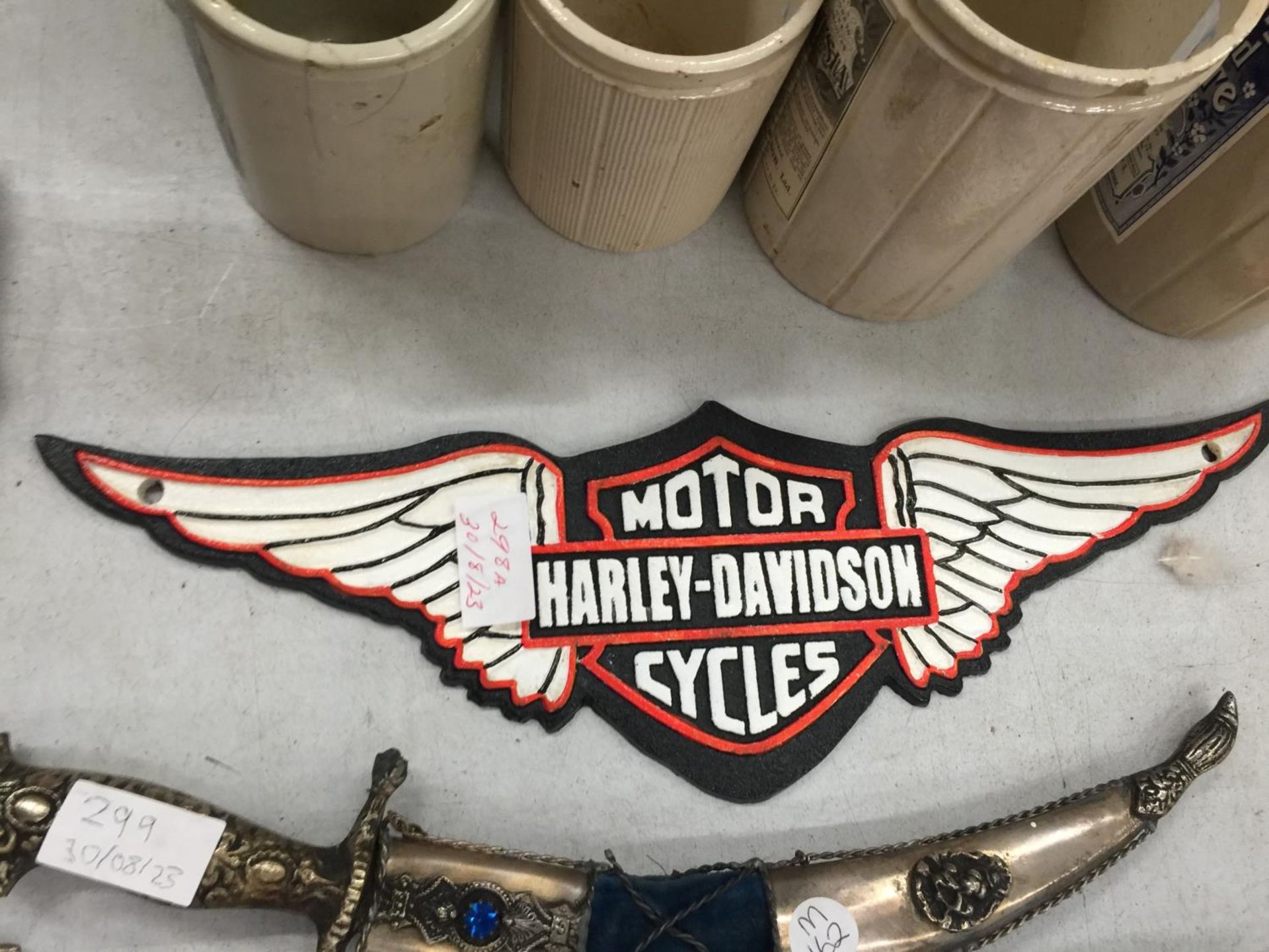 A CAST HARLEY DAVIDSON MOTOR CYCLE SIGN