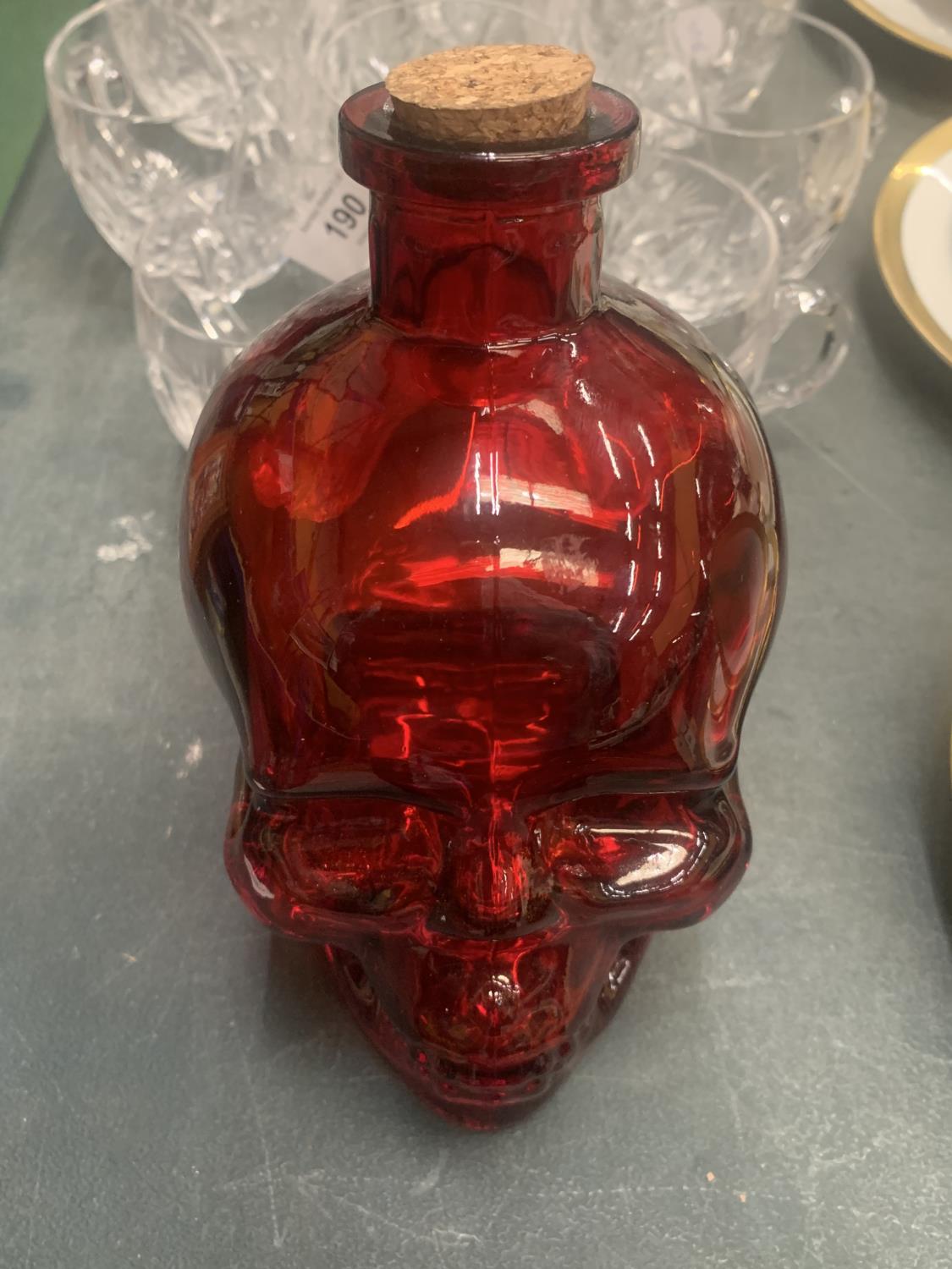 A GLASS RED SKULL NO. 5 SPIRIT DECANTER HEIGHT 16CM