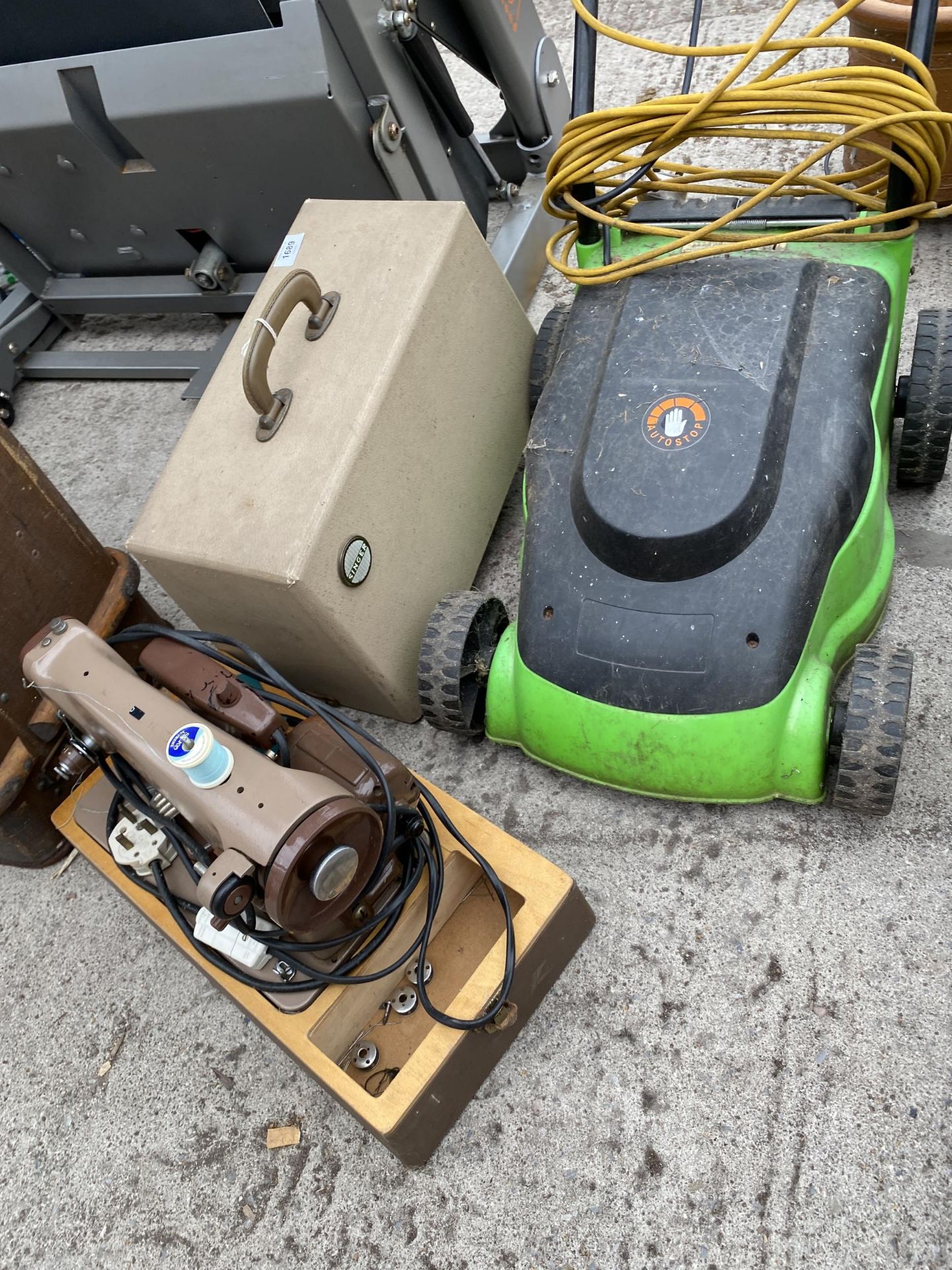 AN ELECTRIC SINGER SEWING MACHINE AND AN ELECTRIC LAWN MOWER - Image 2 of 3