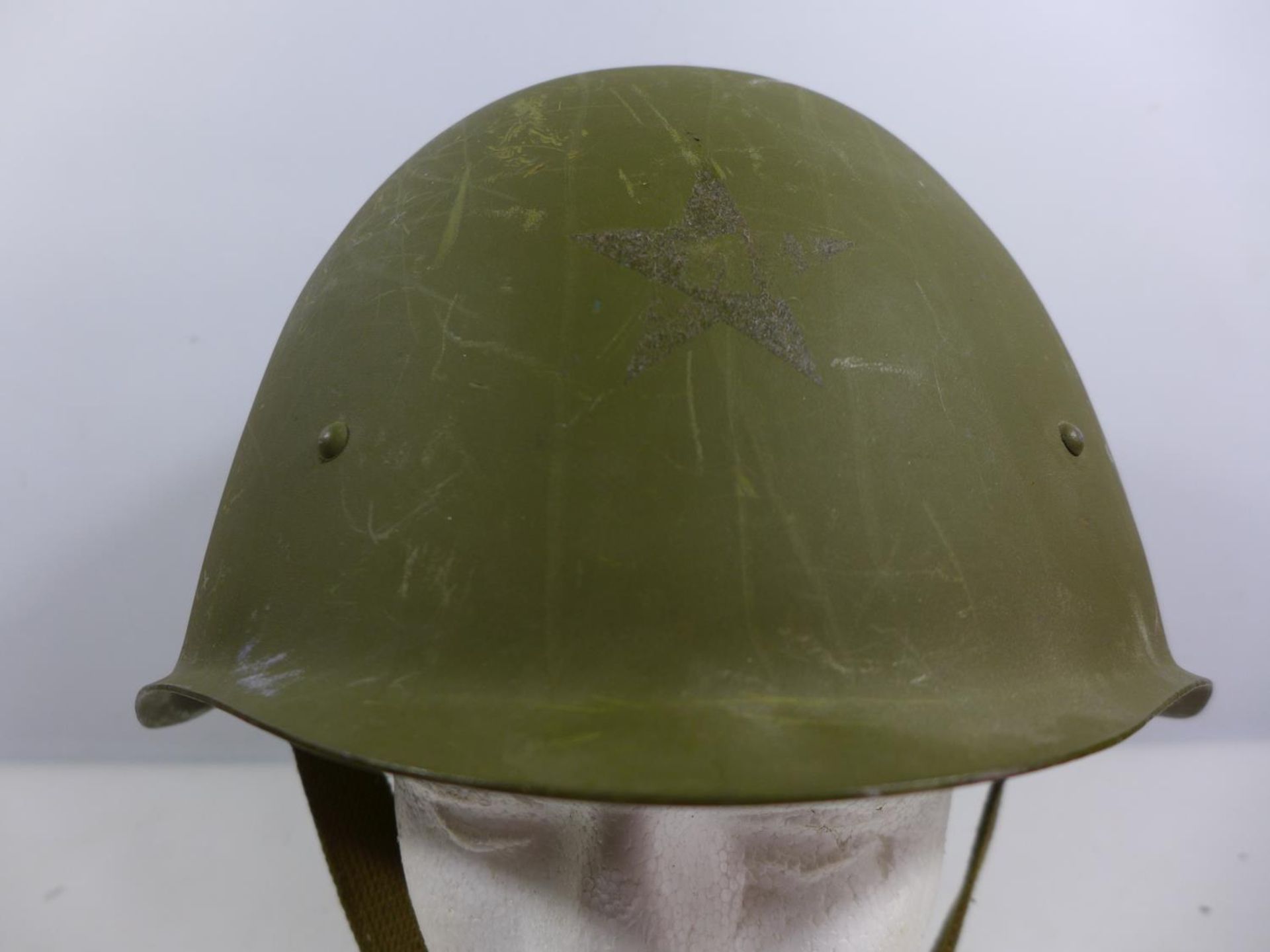 A GREEN PAINTED MILITARY HELMET WITH LEATHER LINING - Image 2 of 5