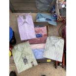 AN ASSORTMENT OF NEW AND PACKAGED MENS SHIRTS