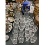 A QUANTITY OF CRYSTAL GLASSES TO INCLUDE DECANTERS, BRANDY, SHERRY, TUMBLERS, ETC