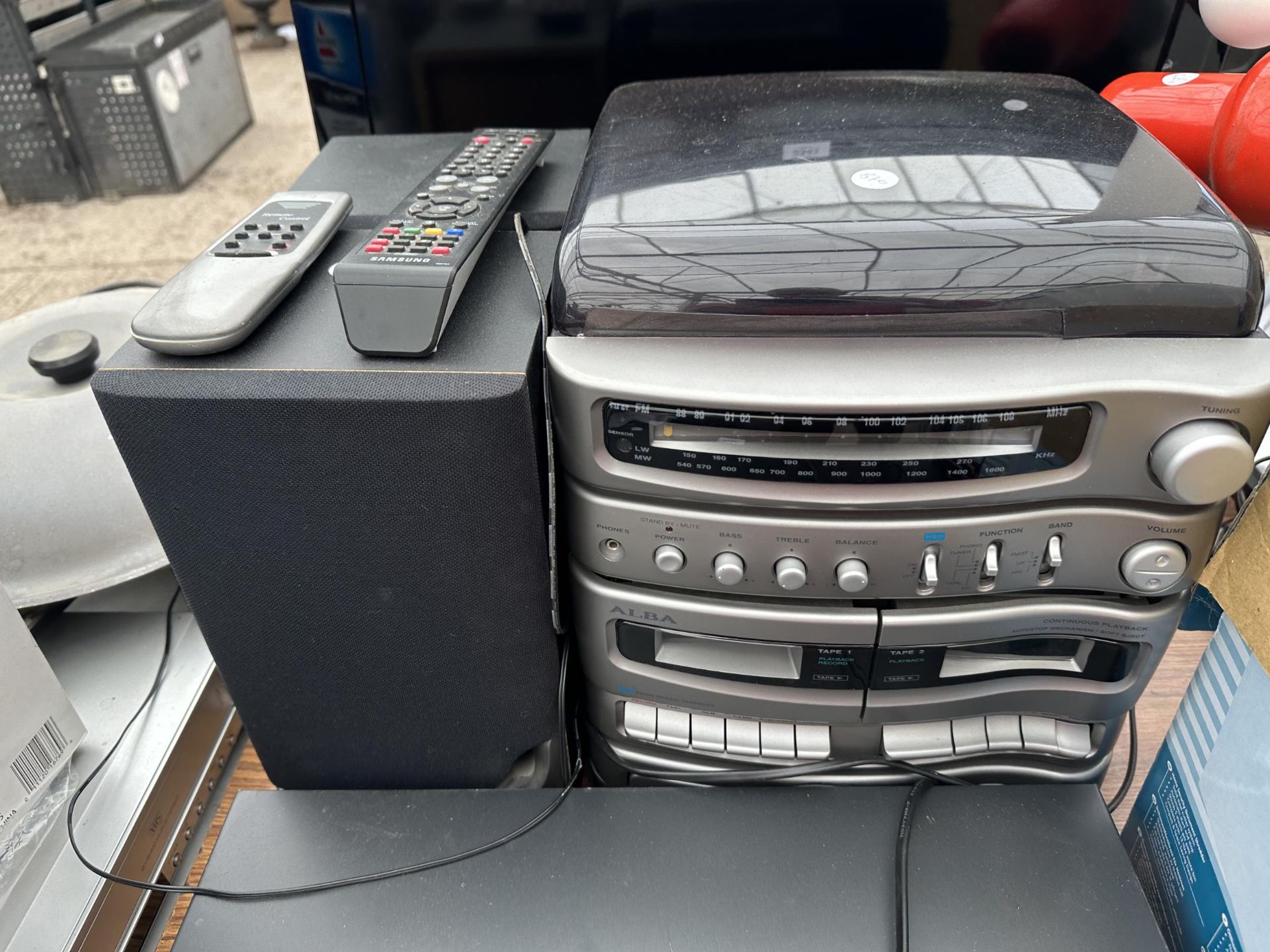 AN ASSORTMENT OF ITEMS TO INCLUDE A SAMSUNG VHS/DVD PLAYER, A HEATER AND A STEREO SYSTEM ETC - Image 3 of 4