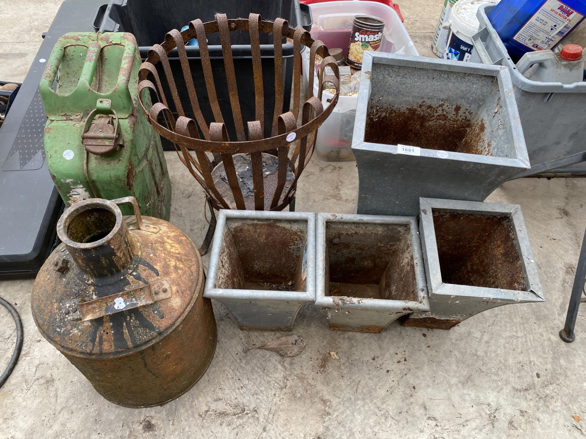 AN ASSORTMENT OF ITEMS TO INCLUDE PLANTERS, A JERRY CAN AND A FIRE PIT ETC