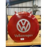 A RED VW PETROL CAN WITH BRASS TOP