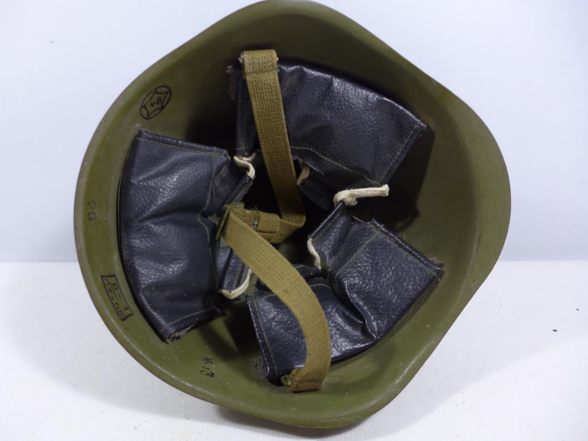 A GREEN PAINTED MILITARY HELMET WITH LEATHER LINING - Image 4 of 5