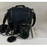 A SONY A200 DIGITAL SLR CAMERA WITH 0.38M/1.3FT MACRO LENS, CHARGER, MANUAL & CASE