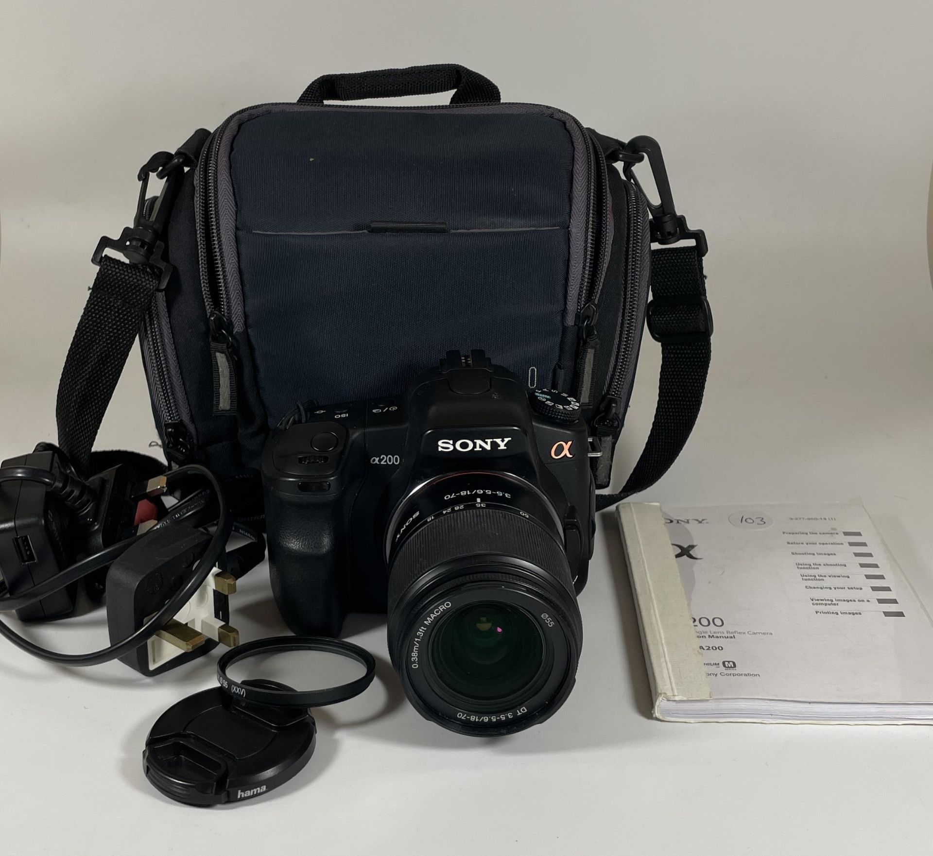 A SONY A200 DIGITAL SLR CAMERA WITH 0.38M/1.3FT MACRO LENS, CHARGER, MANUAL & CASE