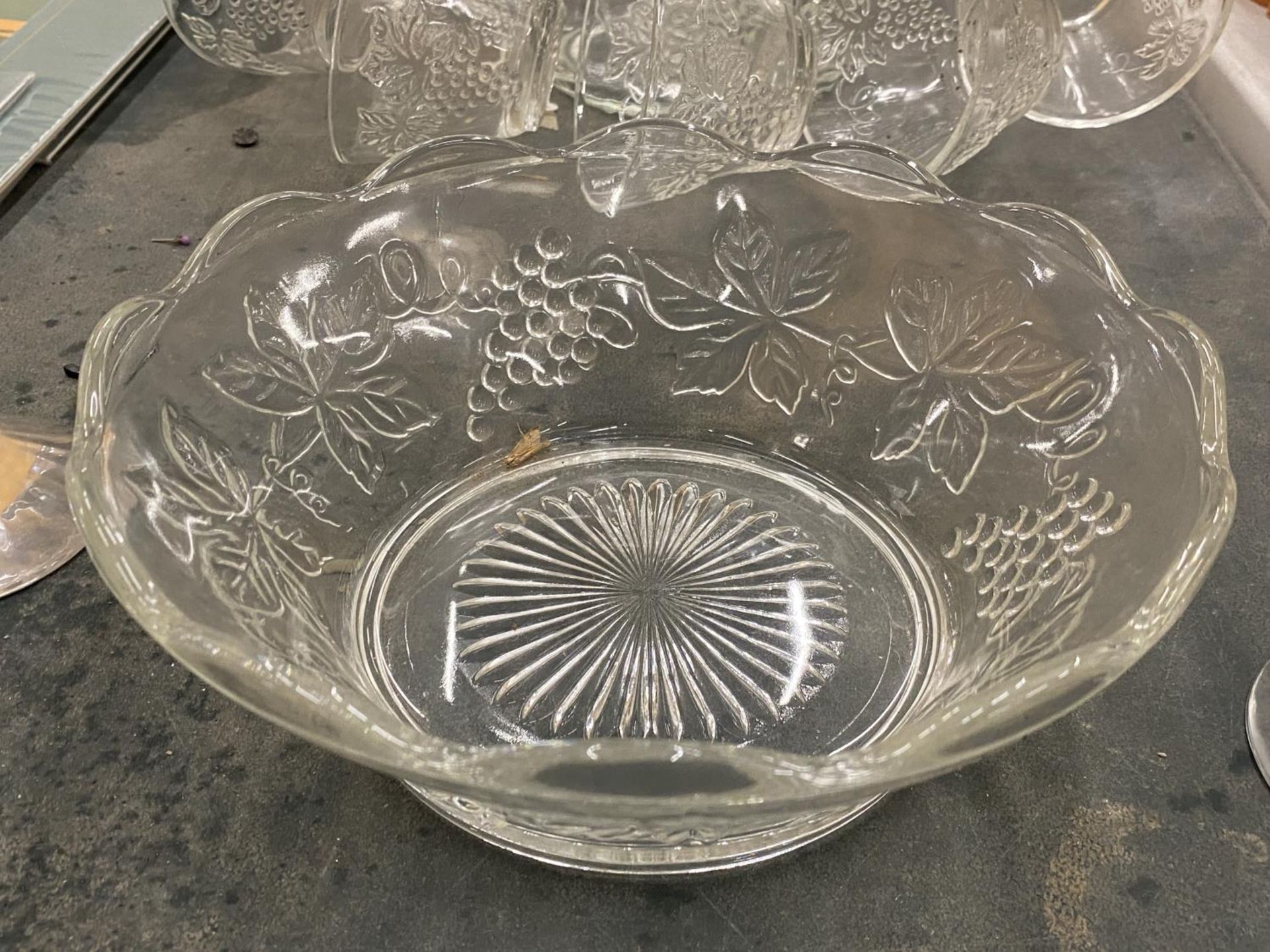 A GLASS PUNCH BOWL WITH CUPS DECORATED WITH GRAPES, TWO CHAMPAGNE FLUTES, ETC - Image 3 of 4