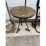 A WOODEN TOPPED BISTRO TABLE WITH HEAVY METAL LEGS