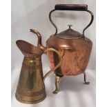 A VINTAGE COPPER KETTLE ON BRASS TRIPOD STAND AND FURTHER COPPER AND BRASS JUG