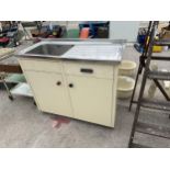 A VINTAGE AND RETRO METAL KITCHEN SINK UNIT