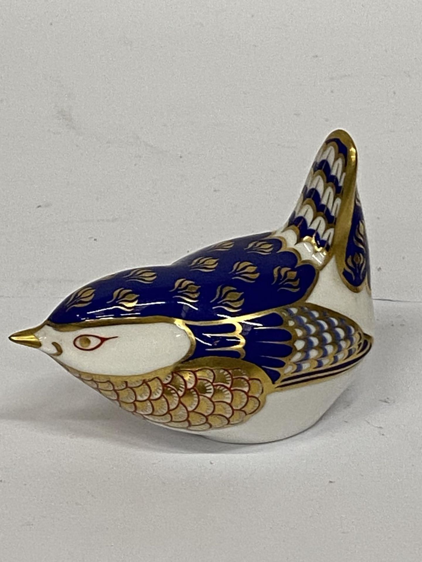 A ROYAL CROWN DERBY WREN WITH GOLD STOPPER