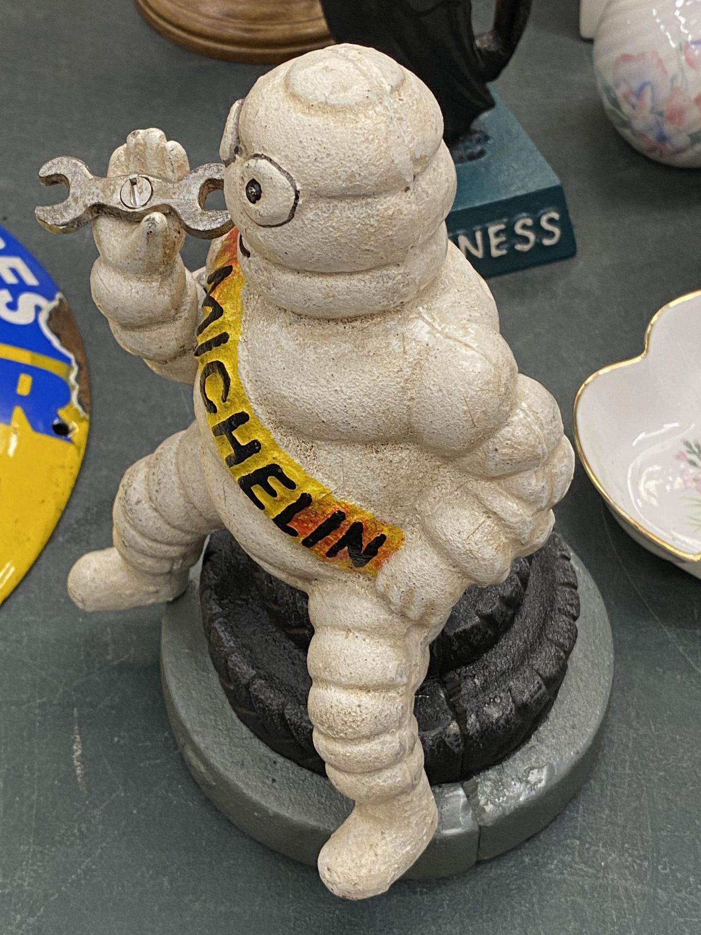 A CAST MICHELIN MAN ON A TYRE MONEY BOX, HEIGHT 19CM - Image 3 of 3