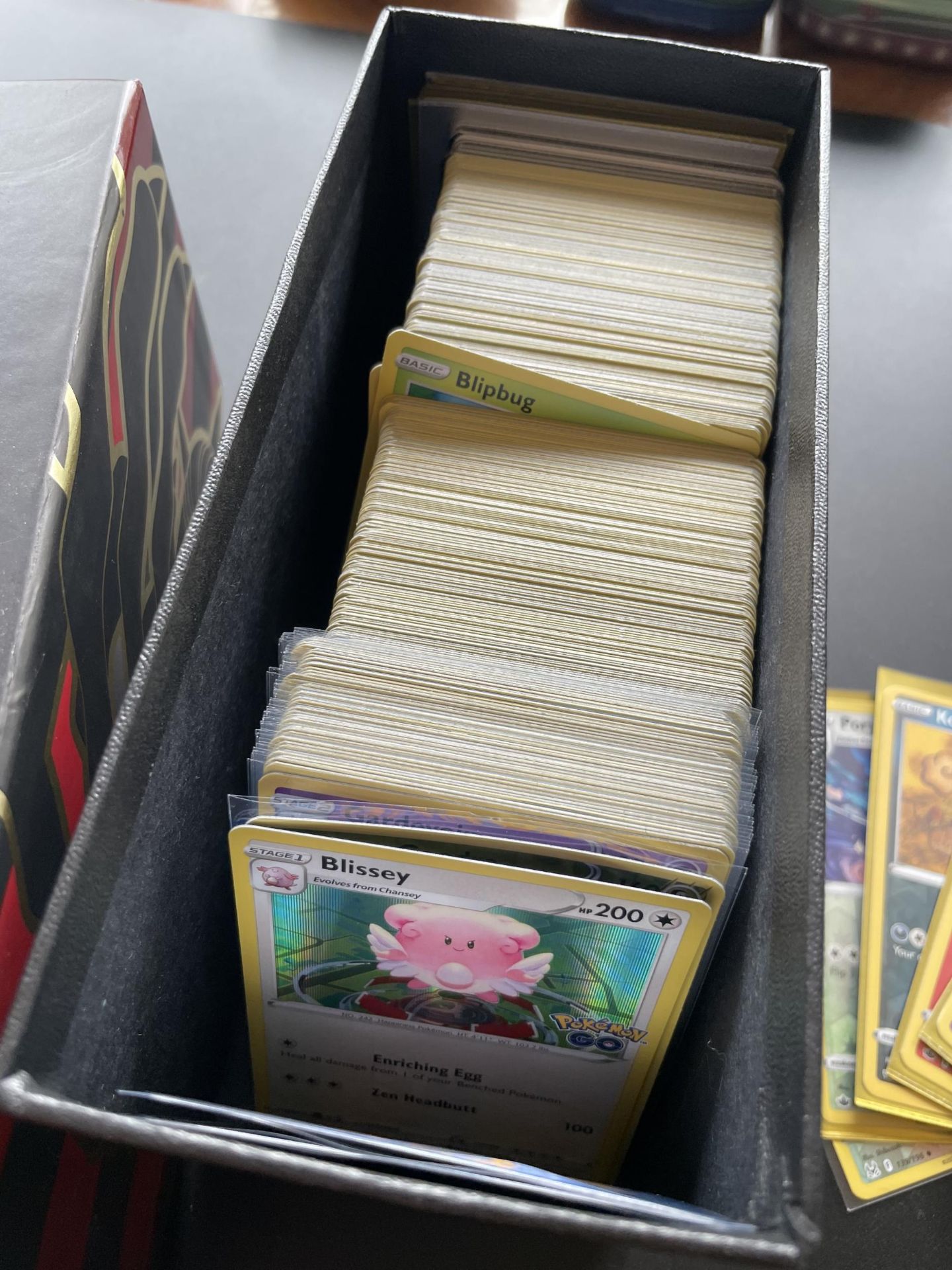 A TRAINER BOX OF ASSORTED POKEMON CARDS, HOLOS, TOKENS ETC - Image 2 of 5