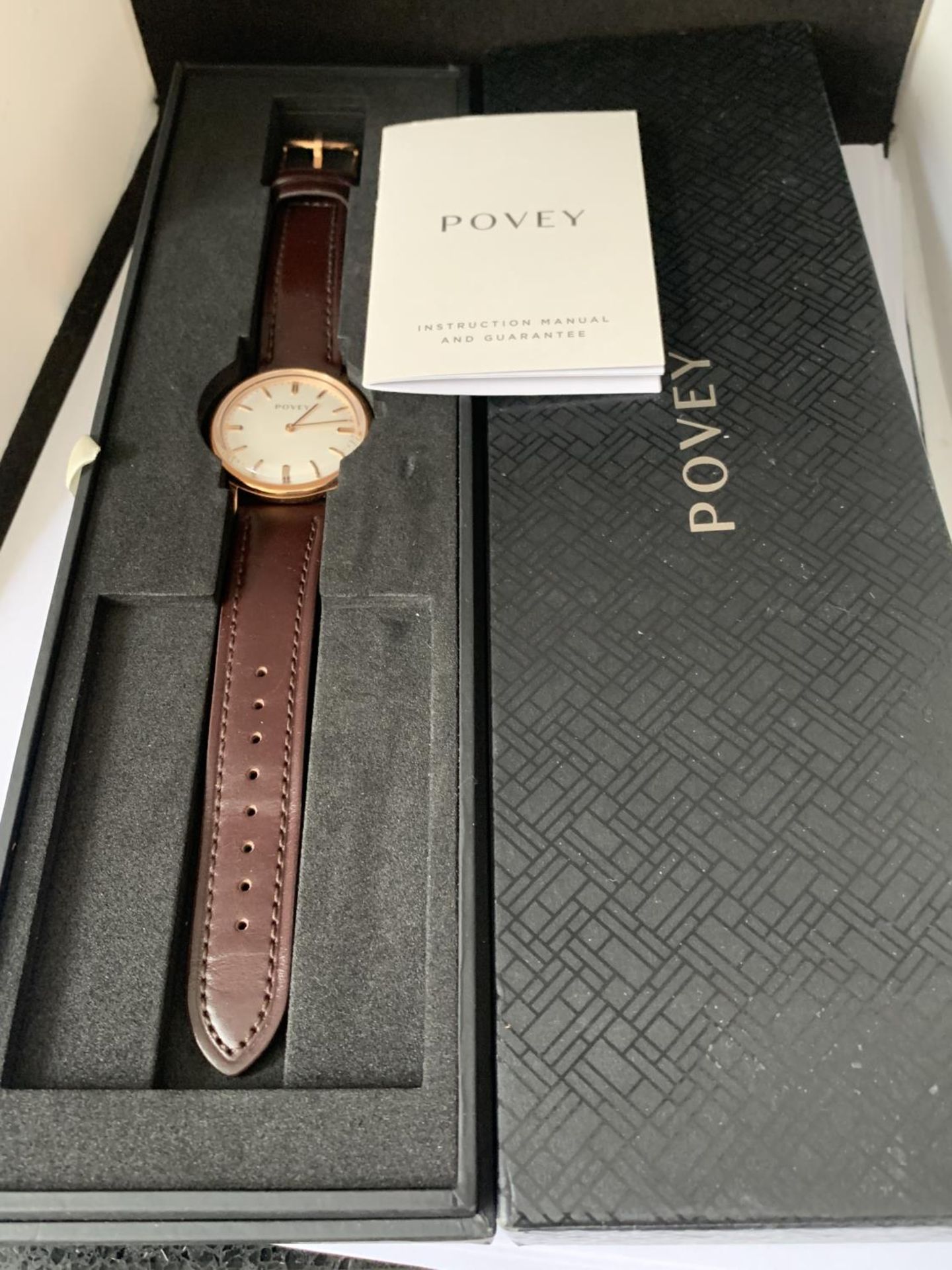 AN AS NEW AND BOXED POVEY WRIST WATCH SEEN WORKING BUT NO WARRANTY