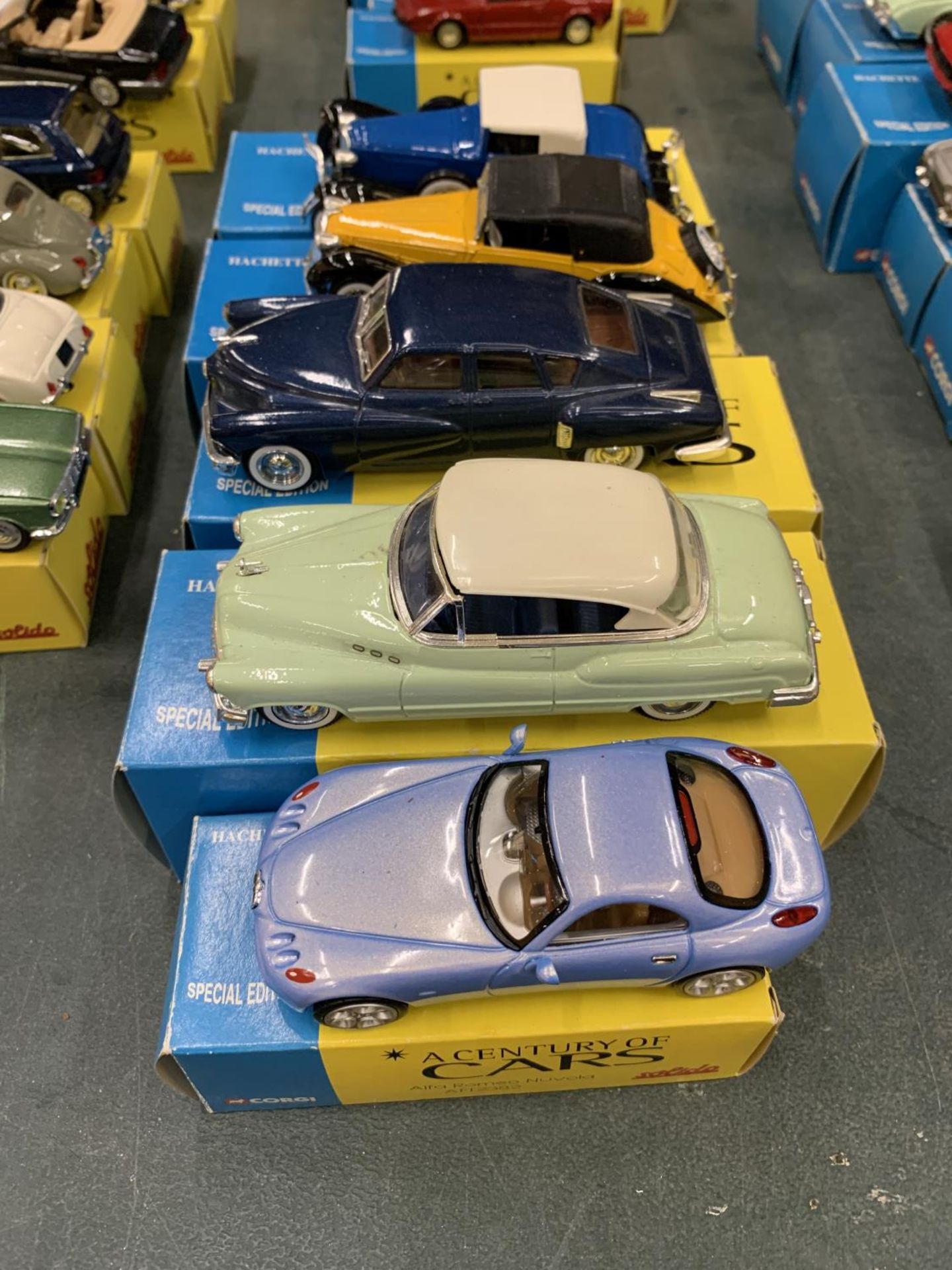 FIVE BOXED CORGI 'A CENTURY OF CARS' TO INCLUDE AN ALFA ROMEO, A CORD L29, TUCKER 1948, BUICK